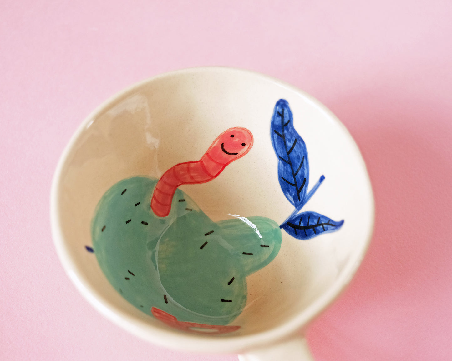 Cup with an Apple and Snake