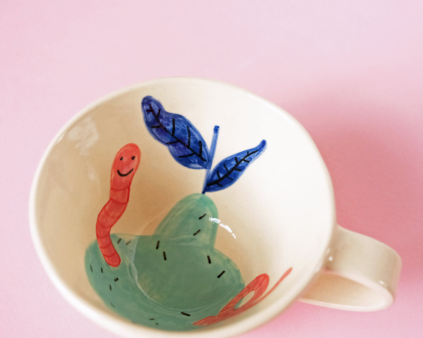 Cup with an Apple and Snake
