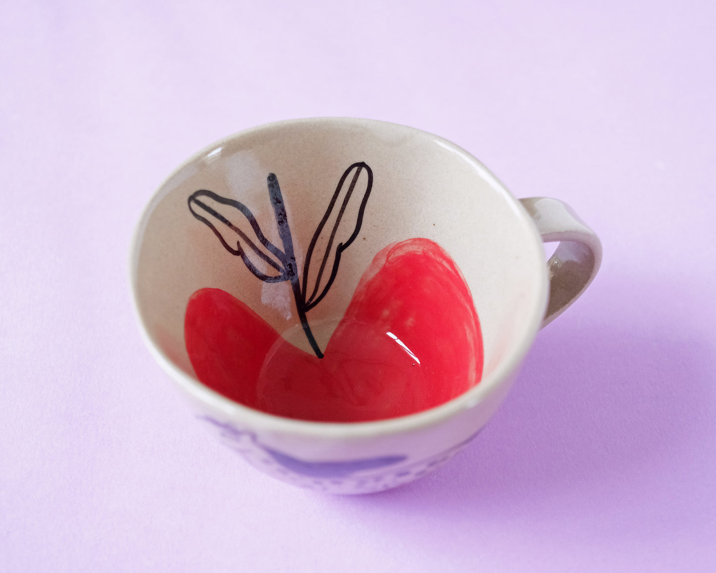 Cup with an Apple and 2 Running Horses