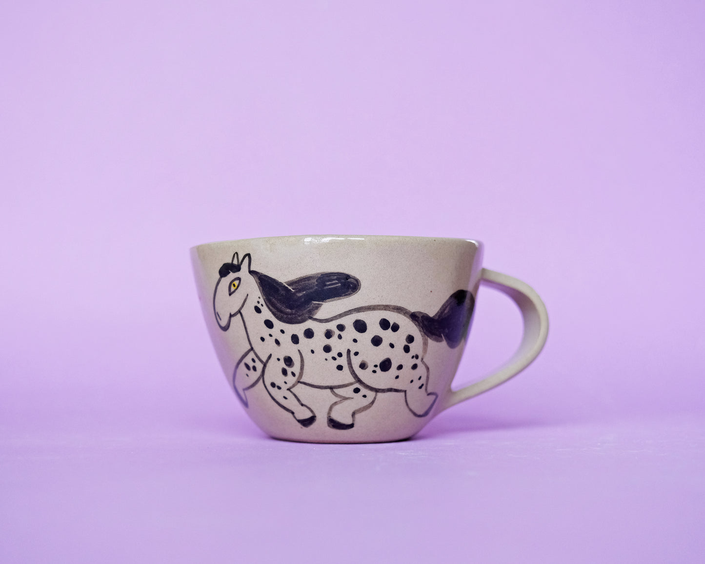 Cup with an Apple and 2 Running Horses