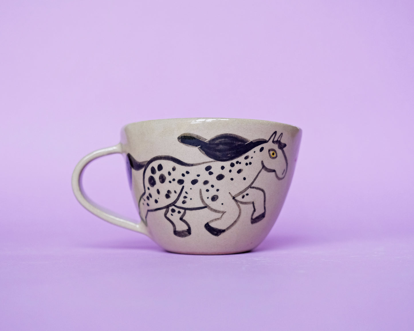 Cup with an Apple and 2 Running Horses