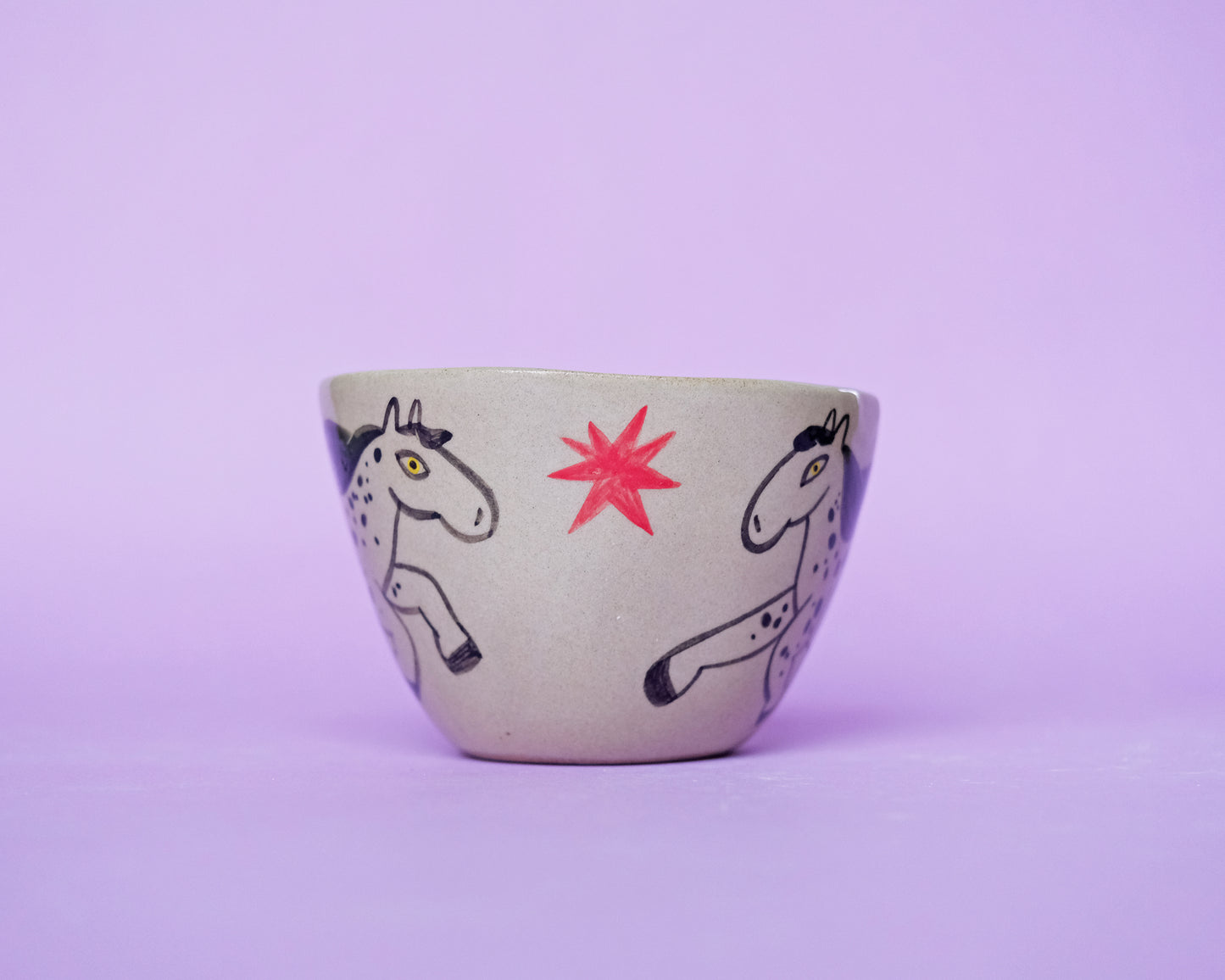 Cup with an Apple and 2 Running Horses